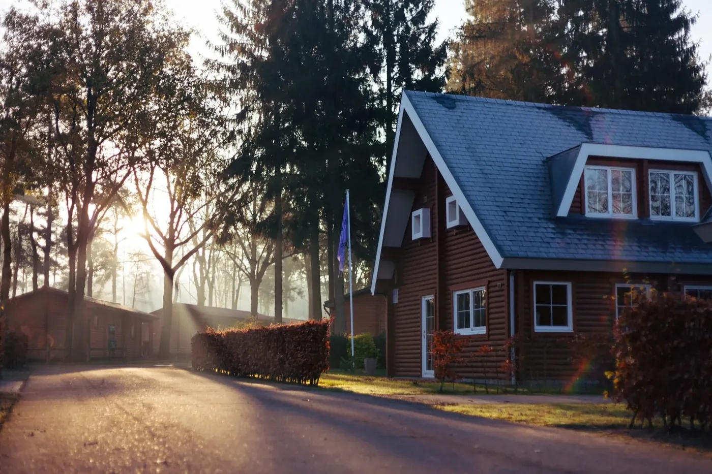 A the Des Moines metro home at dusk with new gutters and roofing by Patriot Gutters and Insulation